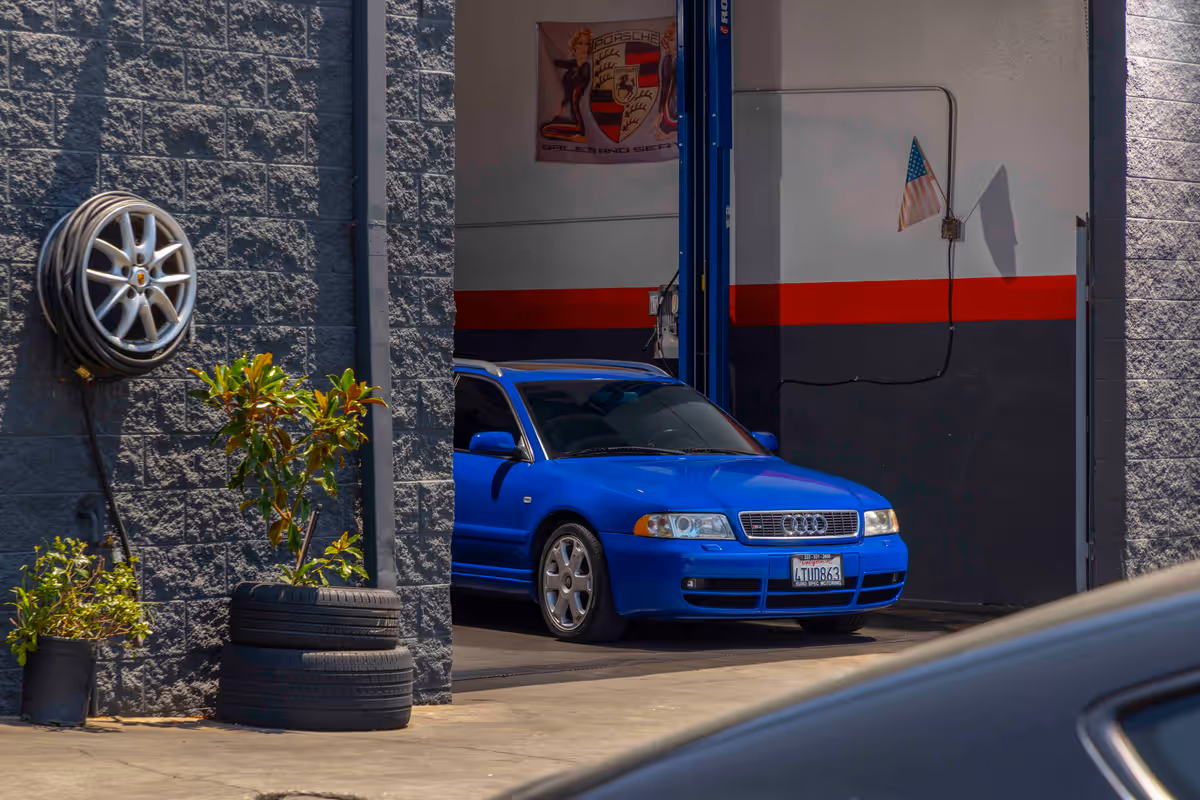 Blue Audi parked in a Euro Spec Motoring service bay