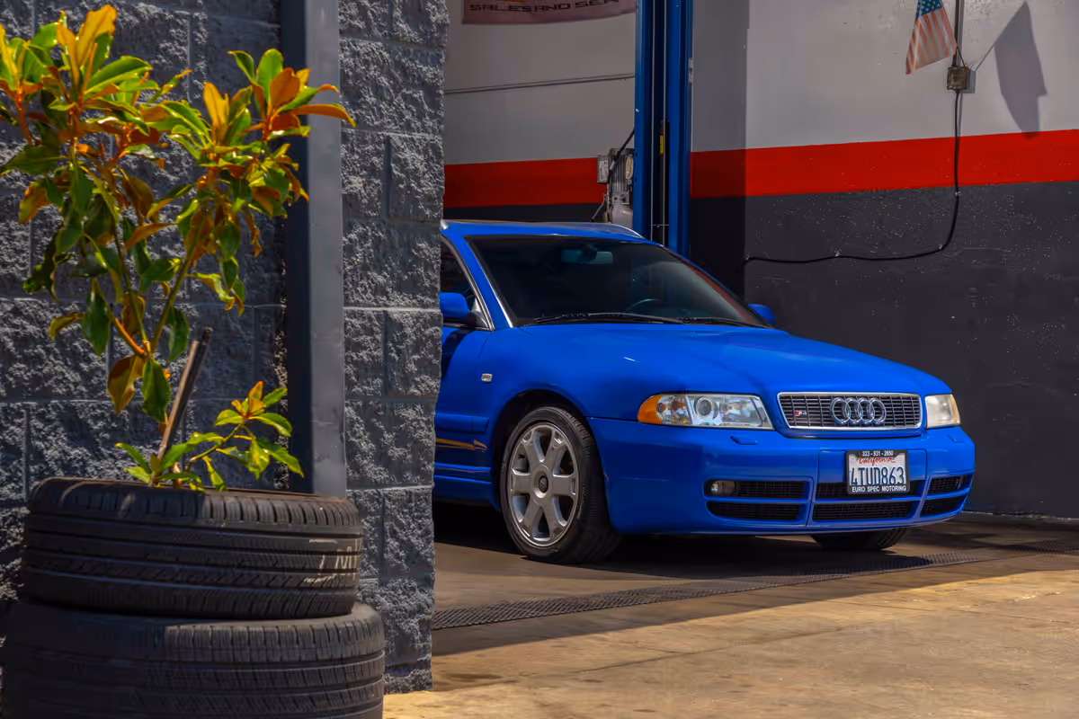 Blue Audi parked inside a Euro Spec Motoring service bay