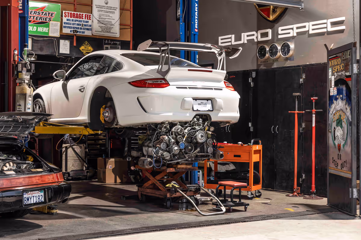 White Porsche raised in a Euro Spec Motoring service bay