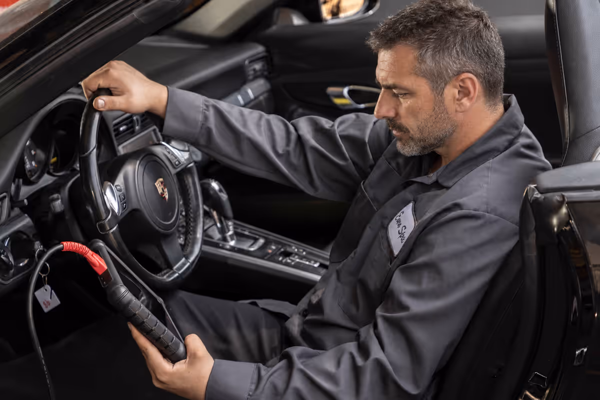 Diagnostic equipment being used inside a Porsche at Euro Spec Motoring